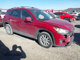 2014 Mazda CX-5 Touring with VIN JM3KE2CYXE0337149, listed as a IAAI auction lot 41696363 with 128,165 mi miles. Bid and sale history available at carsss.com. Image 1.
