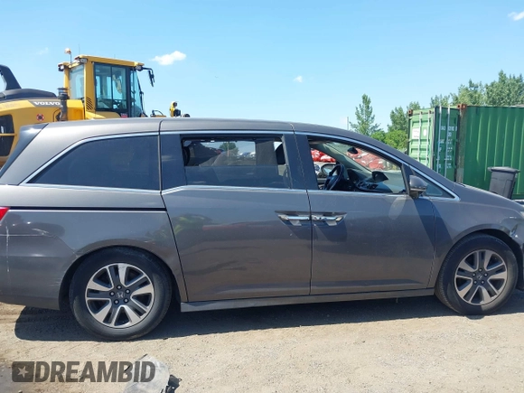 2014 Honda Odyssey Touring with VIN 5FNRL5H90EB082691, listed as a IAAI auction lot 42572977 with 54,413 mi miles and . Bid and sale history available at DreamBid. Image 13.