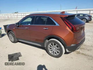 2021 Cadillac XT4 FWD Premium Luxury z VIN 1GYFZCR46MF076066, wystawiony jako Copart lot #47493235 z przebiegiem 21 550 mil mil oraz Nie do naprawy. Historia ofert i sprzedaży dostępna na DreamBid. Obrazek 2.