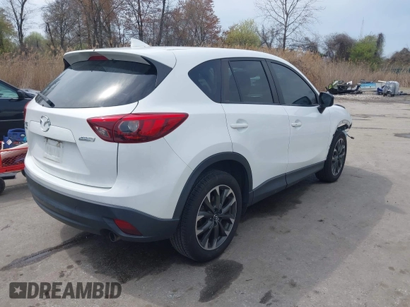 2016 Mazda CX-5 Grand Touring with VIN JM3KE4DY6G0618121, listed as a IAAI auction lot 41958805 with 101,232 mi miles. Bid and sale history available at carsss.com. Image 4.