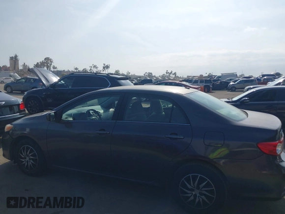 2011 Toyota Corolla L with VIN JTDBU4EE3BJ090749, listed as a IAAI auction lot 42106633 with 209,824 mi miles. Bid and sale history available at carsss.com. Image 15.
