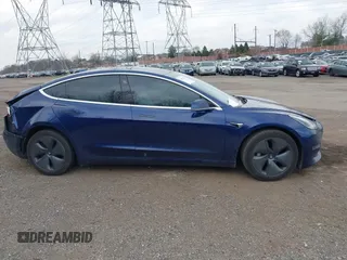 2018 Tesla Model 3 Long Range Battery with VIN 5YJ3E1EB2JF056166, listed as a IAAI auction lot 41847972 with 126,126 mi miles and . Bid and sale history available at DreamBid. Image 14.