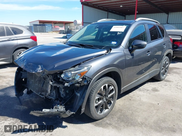 2016 Mazda CX-5 Grand Touring with VIN JM3KE2DY9G0824196, listed as a IAAI auction lot 41801887 with 88,625 mi miles. Bid and sale history available at carsss.com. Image 2.
