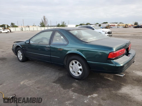1994 Ford Thunderbird LX with VIN 1FALP62W6RH128762, listed as a Copart auction lot 84306604 with 68,314 mi miles and Salvage Title. Bid and sale history available at DreamBid. Image 2.