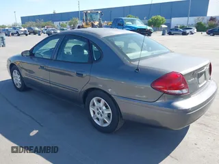 2005 Ford Taurus SE with VIN 1FAFP53U95A289971, listed as a IAAI auction lot 42143134 with 167,702 mi miles. Bid and sale history available at carsss.com. Image 3.
