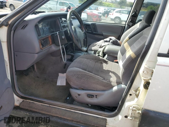 1997 Jeep Grand Cherokee Laredo with VIN 1J4GZ58S8VC647415, listed as a Copart auction lot 49258934 with 0 mi miles and Salvage Title. Bid and sale history available at carsss.com. Image 7.