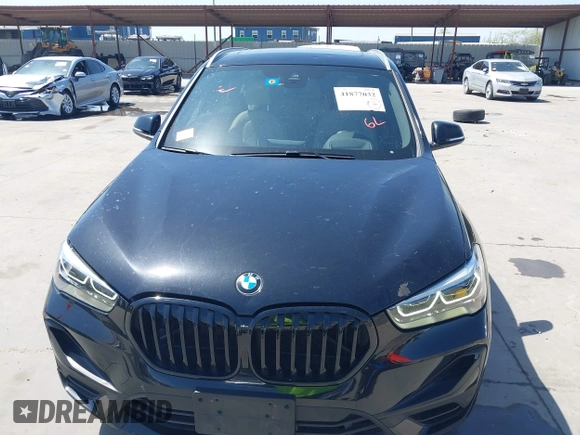 2021 BMW X1 sDrive28i with VIN WBXJG7C07M3M65841, listed as a IAAI auction lot 41877032 with 79,817 mi miles and . Bid and sale history available at DreamBid. Image 6.