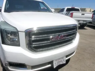 2015 GMC Yukon SLE z VIN 1GKS1AKC4FR646024, wystawiony jako Copart lot #64723945 z przebiegiem 238 929 mil mil oraz Czysty tytuł • Clean title. Historia ofert i sprzedaży dostępna na DreamBid. Obrazek 11.