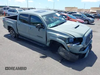 2022 Toyota Tacoma SR with VIN 3TMCZ5AN0NM517314, listed as a IAAI auction lot 41980614 with 17,957 mi miles and . Bid and sale history available at DreamBid. Image 1.