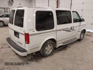 1998 Chevrolet Astro Cargo Van YF7 Upfitter with VIN 1GBDM19W1WB121821, listed as a IAAI auction lot 41463704 with 141,724 mi miles. Bid and sale history available at carsss.com. Image 4.