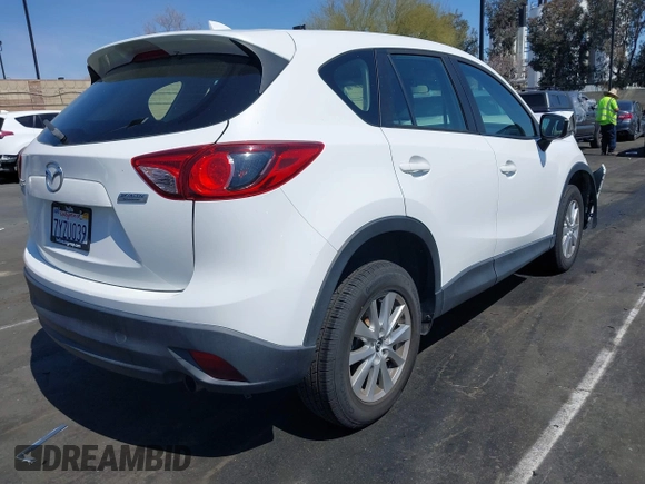 2016 Mazda CX-5 Sport with VIN JM3KE2BY9G0825285, listed as a IAAI auction lot 41841833 with 96,915 mi miles. Bid and sale history available at carsss.com. Image 4.