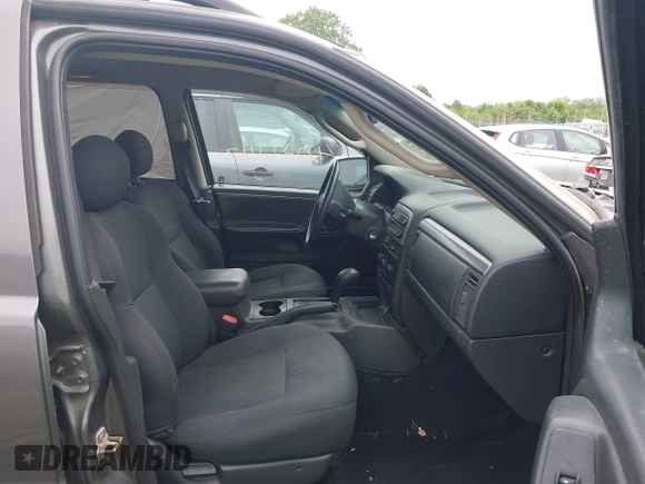 2003 Jeep Grand Cherokee Laredo z VIN 1J4GW48S73C545863, wystawiony jako IAAI lot #42222247 z przebiegiem 128 529 mil mil oraz . Historia ofert i sprzedaży dostępna na DreamBid. Obrazek 5.