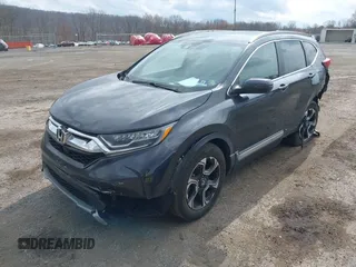 2019 Honda CR-V Touring with VIN 2HKRW2H9XKH636354, listed as a IAAI auction lot 41902615 with 66,781 mi miles and . Bid and sale history available at DreamBid. Image 2.