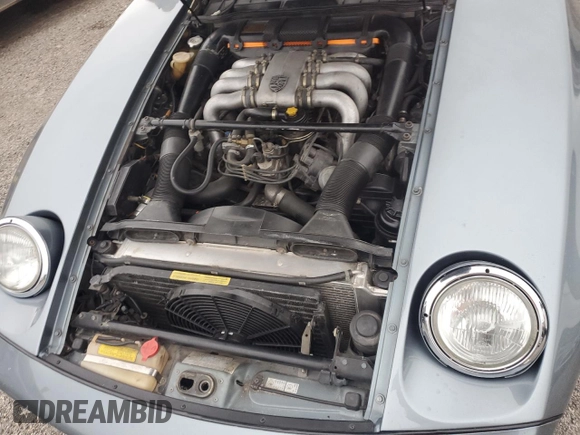 1983 Porsche 928 z VIN WP0ZZZ92ZDS841622, wystawiony jako Copart lot #76995304 z przebiegiem 83 862 mil mil oraz Szkody całkowita. Historia ofert i sprzedaży dostępna na DreamBid. Obrazek 11.