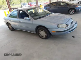 1998 Mercury Sable GS z VIN 1MEFM50U4WG620587, wystawiony jako IAAI lot #42405527 z przebiegiem 193 566 mil mil oraz . Historia ofert i sprzedaży dostępna na DreamBid. Obrazek 1.
