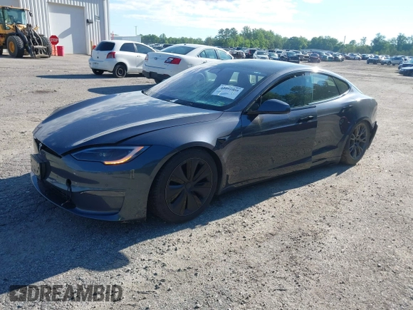 2022 Tesla Model S with VIN 5YJSA1E57NF479056, listed as a IAAI auction lot 42091009 with 78,272 mi miles and . Bid and sale history available at DreamBid. Image 2.