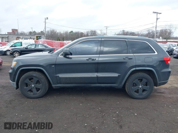 2011 Jeep Grand Cherokee Laredo with VIN 1J4RR4GGXBC597743, listed as a IAAI auction lot 41897286 with 253,111 mi miles and . Bid and sale history available at DreamBid. Image 14.