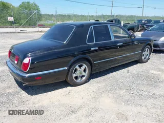 1999 Bentley Arnage z VIN SCBLB51E1XCX01401, wystawiony jako IAAI lot #42133144 z przebiegiem 29 699 mil mil oraz . Historia ofert i sprzedaży dostępna na DreamBid. Obrazek 4.