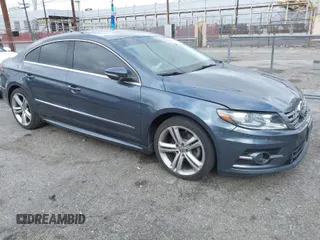 2013 Volkswagen CC Sport with VIN WVWBP7AN3DE571837, listed as a IAAI auction lot 41784447 with 156,834 mi miles. Bid and sale history available at carsss.com. Image 1.