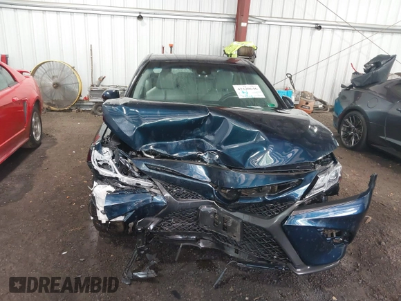 2018 Toyota Camry LE z VIN 4T1B11HK8JU517019, wystawiony jako IAAI lot #42220646 z przebiegiem 98 924 mil mil oraz . Historia ofert i sprzedaży dostępna na DreamBid. Obrazek 6.