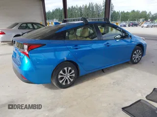 2020 Toyota Prius LE with VIN JTDL9RFU5L3018787, listed as a IAAI auction lot 42723431 with 30,793 mi miles and . Bid and sale history available at DreamBid. Image 4.