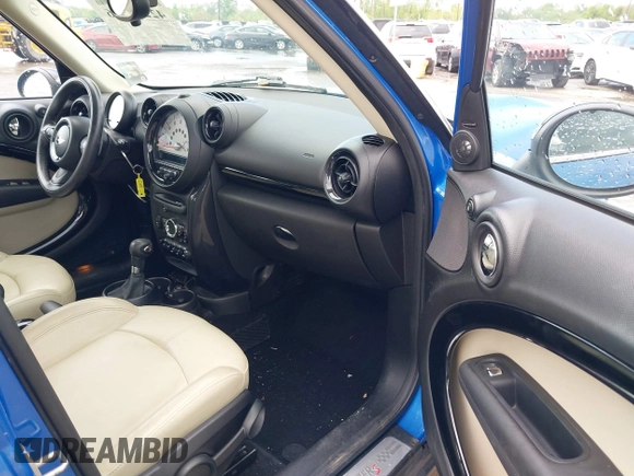 2014 MINI Countryman S with VIN WMWZC5C52EWP38659, listed as a IAAI auction lot 42229976 with 115,229 mi miles and . Bid and sale history available at DreamBid. Image 5.