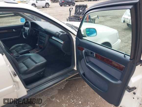 1996 Audi A6 z VIN WAUJA84A9TN106938, wystawiony jako IAAI lot #42287751 z przebiegiem 163 427 mil mil oraz . Historia ofert i sprzedaży dostępna na DreamBid. Obrazek 5.