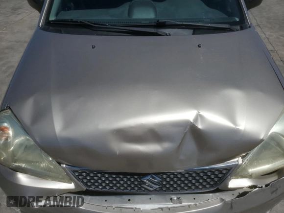 2006 Suzuki Aerio Premium z VIN JS2RA62S165300427, wystawiony jako Copart lot #57363605 z przebiegiem 141 824 mil mil oraz Szkoda całkowita • Salvage title. Historia ofert i sprzedaży dostępna na DreamBid. Obrazek 11.