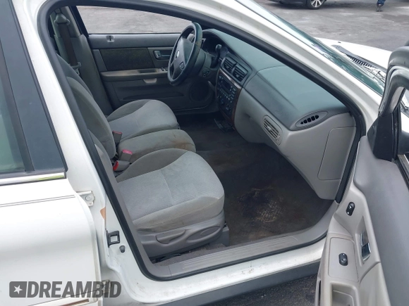 2002 Mercury Sable GS z VIN 1MEFM50U12G628060, wystawiony jako IAAI lot #42072436 z przebiegiem 139 336 mil mil oraz . Historia ofert i sprzedaży dostępna na DreamBid. Obrazek 5.
