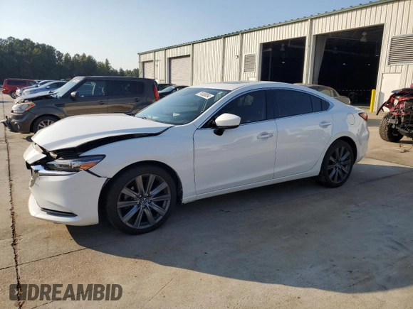 2019 Mazda 6 Grand Touring with VIN JM1GL1TY4K1507123, listed as a Copart auction lot 74100054 with 63,809 mi miles and Salvage Title. Bid and sale history available at carsss.com. Image 1.