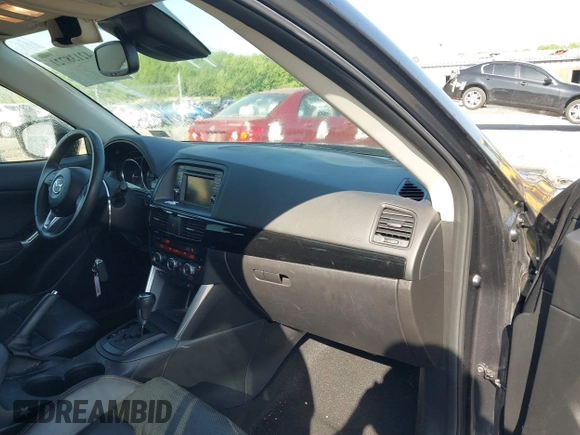 2014 Mazda CX-5 Grand Touring with VIN JM3KE4DY2E0312952, listed as a IAAI auction lot 42138721 with 99,993 mi miles and . Bid and sale history available at DreamBid. Image 5.