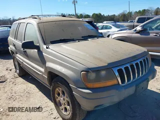 2000 Jeep Grand Cherokee Laredo z VIN 1J4G248S2YC344598, wystawiony jako IAAI lot #41744469 z przebiegiem 210 953 mil mil oraz . Historia ofert i sprzedaży dostępna na DreamBid. Obrazek 1.
