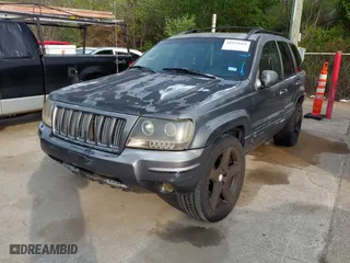2004 Jeep Grand Cherokee Laredo with VIN 1J4GX48S14C218695, listed as a IAAI auction lot 41933611 with 158,290 mi miles. Bid and sale history available at carsss.com. Image 2.
