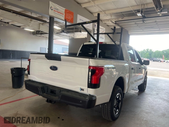 2022 Ford F-150 Lightning Pro with VIN 1FTVW1EL5NWG11725, listed as a IAAI auction lot 42832825 with 5,044 mi miles and . Bid and sale history available at DreamBid. Image 9.