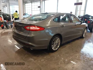 2014 Ford Fusion SE Hybrid with VIN 3FA6P0LU5ER310629, listed as a IAAI auction lot 41941852 with 53,739 mi miles. Bid and sale history available at carsss.com. Image 4.