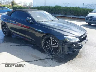 2015 BMW 6 Series 650i z VIN WBAYP9C55FD169777, wystawiony jako IAAI lot #38915604 z przebiegiem 74 418 mil mil oraz . Historia ofert i sprzedaży dostępna na DreamBid. Obrazek 1.