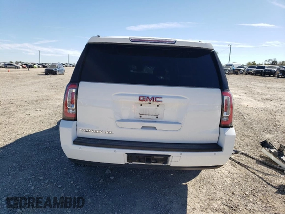 2015 GMC Yukon XL SLE z VIN 1GKS1GKC1FR643293, wystawiony jako Copart lot #82106544 z przebiegiem 164 623 mil mil oraz Szkoda całkowita • Salvage title. Historia ofert i sprzedaży dostępna na DreamBid. Obrazek 6.