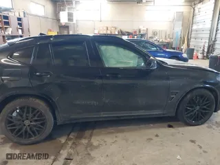2023 BMW X4 M with VIN 5YM23EC05P9R57259, listed as a IAAI auction lot 41003784 with 33,928 mi miles. Bid and sale history available at carsss.com. Image 14.