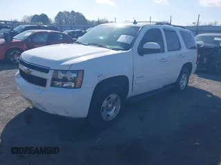 2014 Chevrolet Tahoe LT with VIN 1GNSCBE06ER233105, listed as a IAAI auction lot 41753190 with 161,056 mi miles and . Bid and sale history available at DreamBid. Image 2.