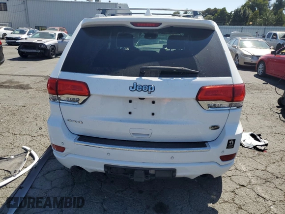 2017 Jeep Grand Cherokee Overland with VIN 1C4RJFCT5HC777748, listed as a Copart auction lot 63121635 with 106,991 mi miles and Salvage title. Bid and sale history available at DreamBid. Image 6.