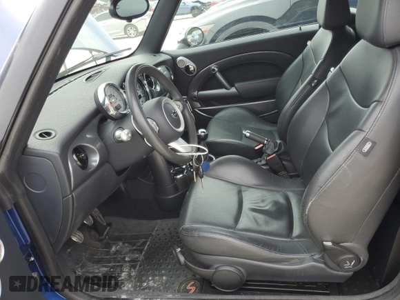 2007 MINI Convertible S with VIN WMWRH33567TJ45123, listed as a Copart auction lot 55702735 with 60,117 mi miles and Salvage title. Bid and sale history available at DreamBid. Image 7.