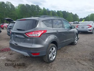 2013 Ford Escape SE with VIN 1FMCU9GX4DUC98328, listed as a IAAI auction lot 41956249 with 114,195 mi miles and . Bid and sale history available at DreamBid. Image 4.
