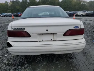 1994 Ford Taurus GL z VIN 1FALP52U5RA152732, wystawiony jako Copart lot #70472324 z przebiegiem 52 781 mil mil oraz Szkoda całkowita • Salvage title. Historia ofert i sprzedaży dostępna na DreamBid. Obrazek 6.