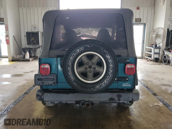 1997 Jeep Wrangler Sport with VIN 1J4FY19SXVP537075, listed as a Copart auction lot 61389915 with Not provided miles and Salvage title. Bid and sale history available at DreamBid. Image 6.