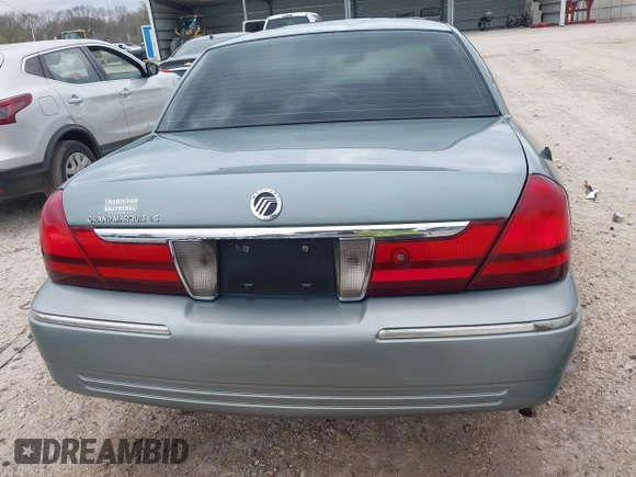 2005 Mercury Grand Marquis LS Premium z VIN 2MEHM75W45X662040, wystawiony jako IAAI lot #41697234 z przebiegiem 214 410 mil mil oraz . Historia ofert i sprzedaży dostępna na DreamBid. Obrazek 17.