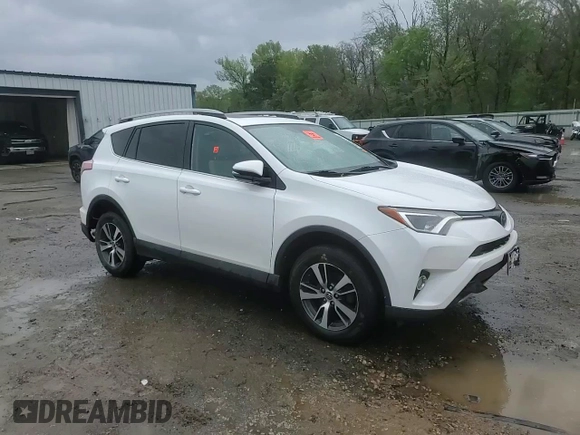 2018 Toyota RAV4 XLE with VIN 2T3WFREV9JW405921, listed as a Copart auction lot 50695175 with 133,019 mi miles and Salvage Title. Bid and sale history available at carsss.com. Image 14.