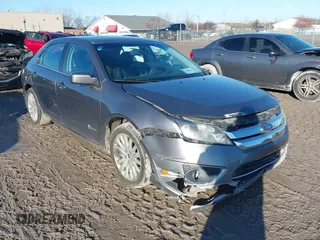 2010 Ford Fusion Hybrid with VIN 3FADP0L39AR125251, listed as a IAAI auction lot 41100606 with 235,612 mi miles. Bid and sale history available at carsss.com. Image 1.