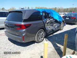 2025 Honda Odyssey Touring z VIN 5FNRL6H84SB028769, wystawiony jako IAAI lot #41856080 z przebiegiem Nie podano mil oraz . Historia ofert i sprzedaży dostępna na DreamBid. Obrazek 4.