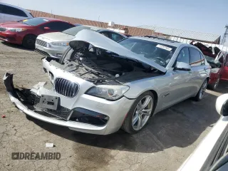2015 BMW 7 Series 740Li with VIN WBAYE4C52FD947168, listed as a Copart auction lot 71287564 with 103,444 mi miles and Salvage Title. Bid and sale history available at DreamBid. Image 1.