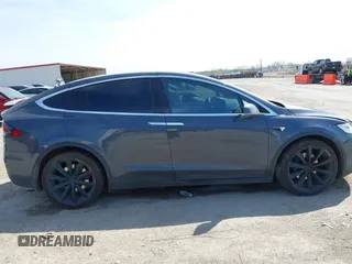2017 Tesla Model X 90D with VIN 5YJXCBE22HF079194, listed as a IAAI auction lot 41895591 with 102,437 mi miles and . Bid and sale history available at DreamBid. Image 13.